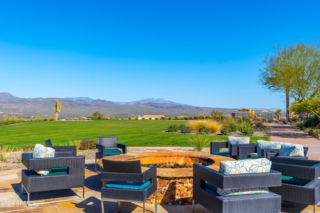 view of patio / terrace with a mountain view and an outdoor living space