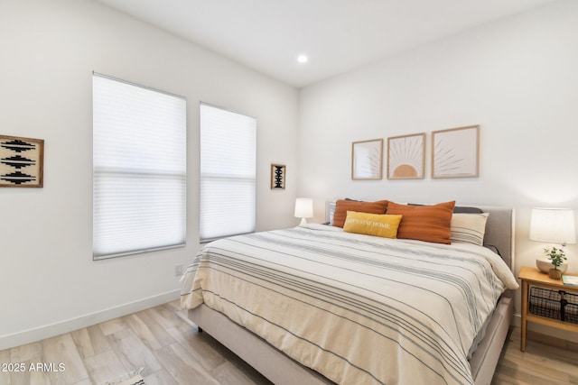 bedroom with light hardwood / wood-style floors