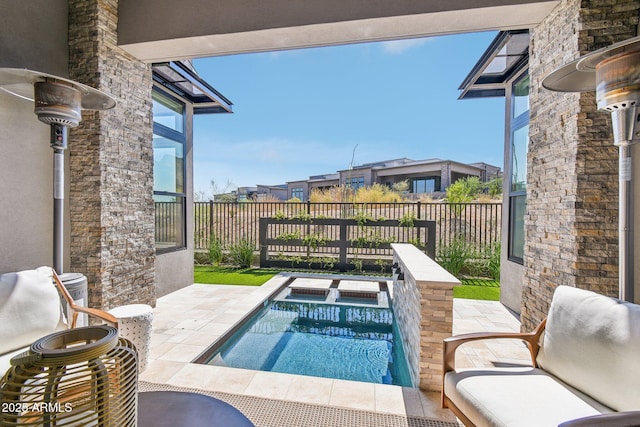 view of swimming pool with an in ground hot tub and a patio