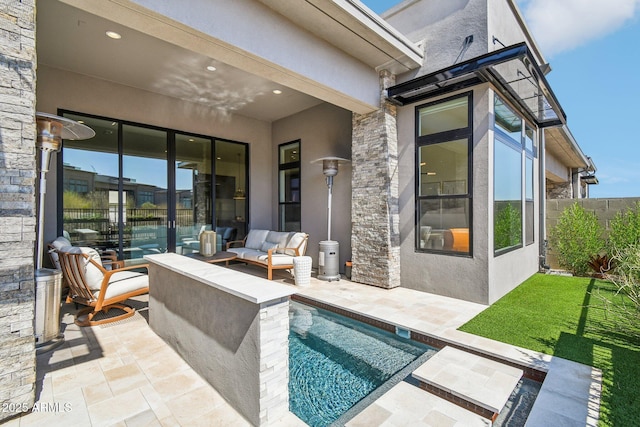 exterior space featuring a fenced in pool and outdoor lounge area