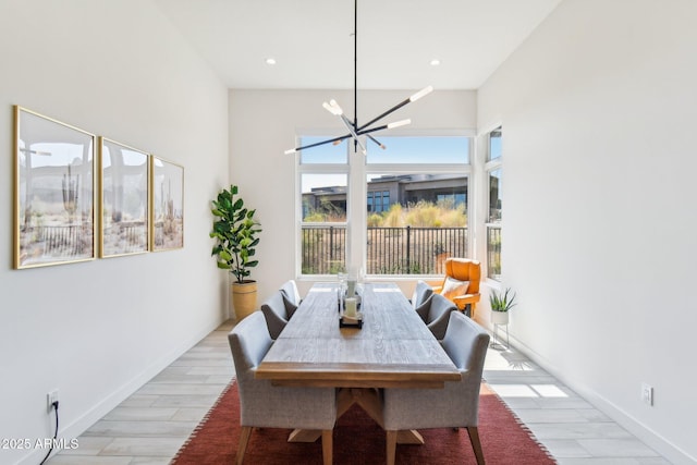 dining room featuring an inviting chandelier and light hardwood / wood-style floors