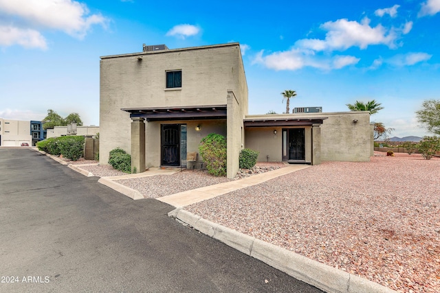 back of house featuring stucco siding