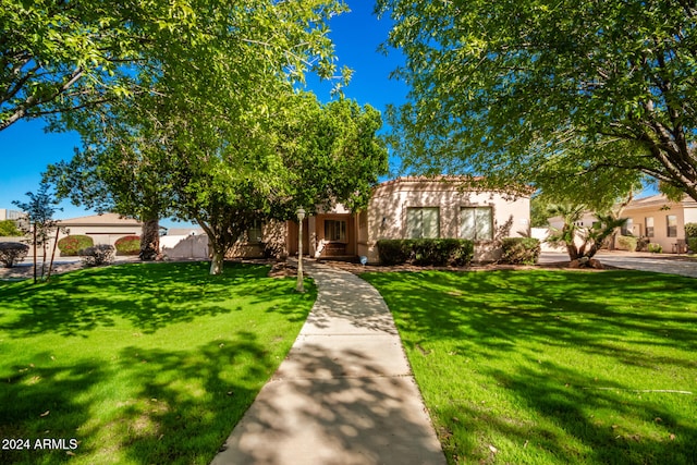 view of front of property with a front lawn