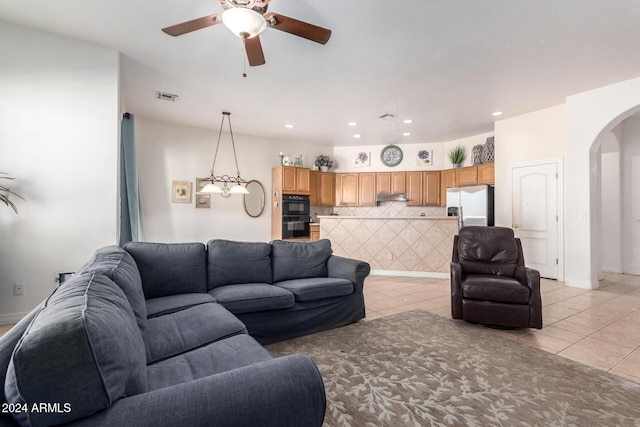 2914 E Gary Way, Phoenix, AZ 85042 - living room with arched walkways, light tile patterned flooring, a ceiling fan, and recessed lighting