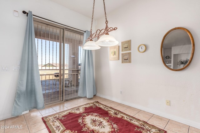 dining space with light tile patterned flooring