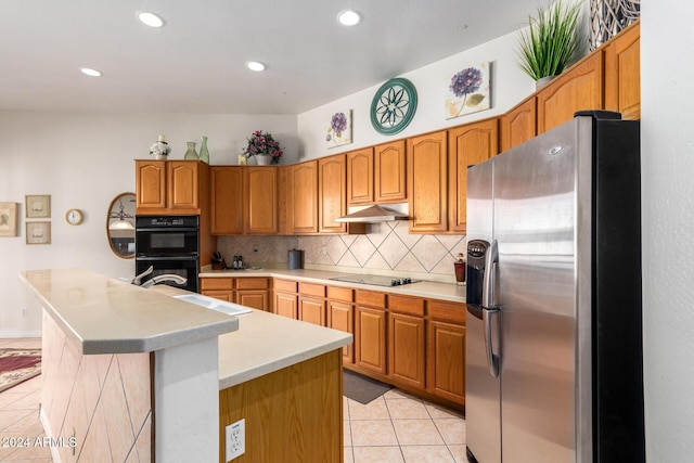 2914 E Gary Way, Phoenix, AZ 85042 - kitchen featuring black appliances, under cabinet range hood, light tile patterned flooring, tasteful backsplash, and light countertops