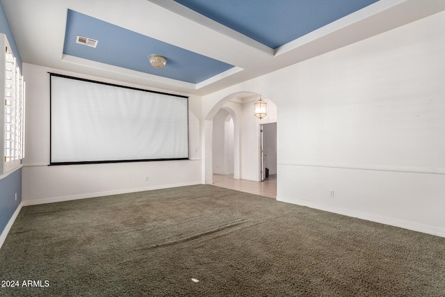 2914 E Gary Way, Phoenix, AZ 85042 - carpeted empty room with arched walkways, a tray ceiling, and baseboards
