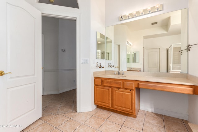 bathroom featuring vanity, tile patterned floors, and an enclosed shower