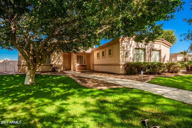 view of front of home with a front yard