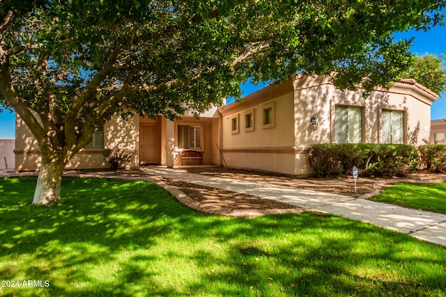 view of front of home with a front yard