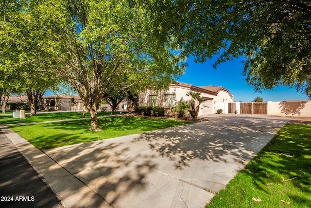 view of front of property featuring a garage and a front yard