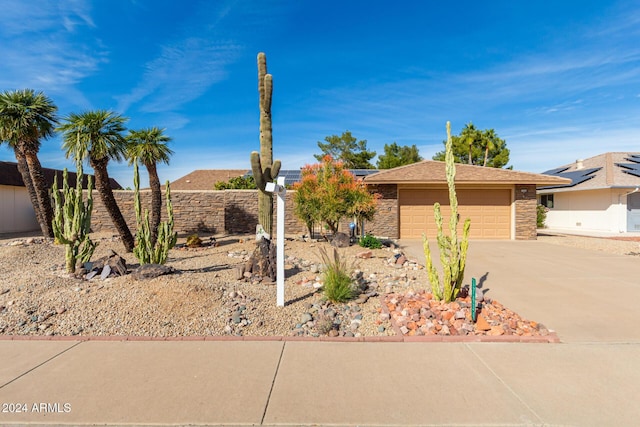 ranch-style home featuring a garage