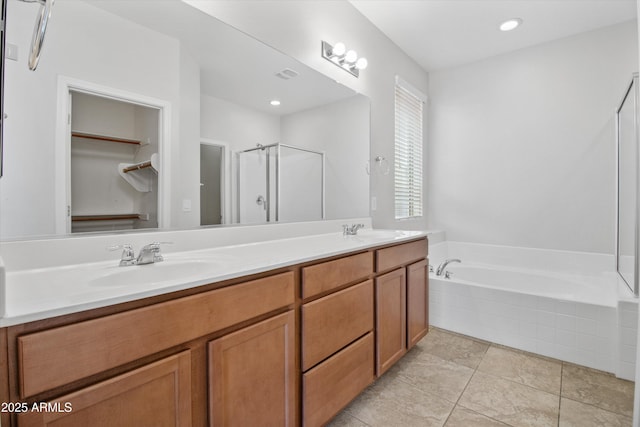 bathroom with vanity, tile patterned floors, and independent shower and bath