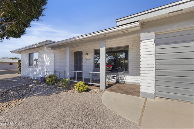 entrance to property featuring a porch