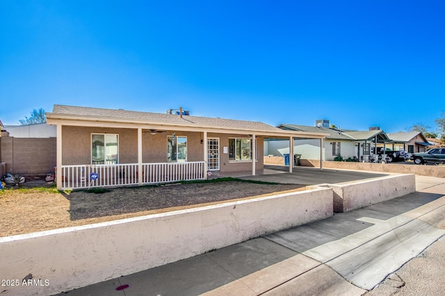 single story home with covered porch and a garage