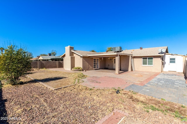 back of house with a patio area and central AC unit