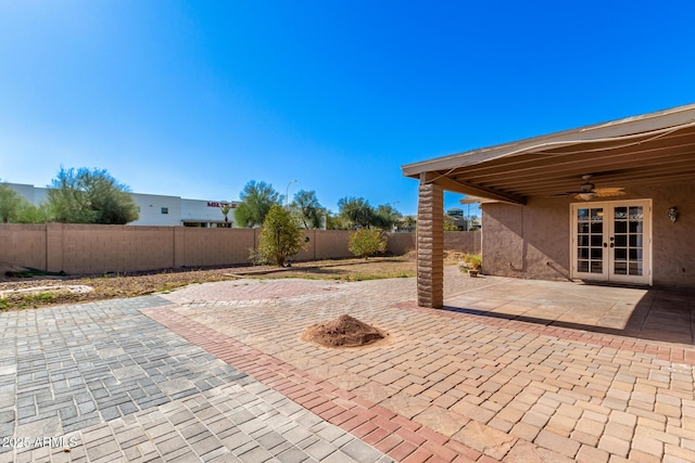 view of patio featuring ceiling fan and french doors