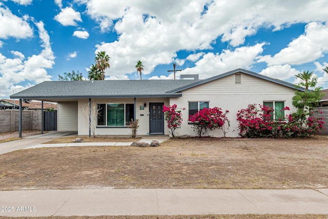 738 S Pomeroy, Mesa, AZ 85210 - ranch-style home with concrete driveway, an attached carport, and roof with shingles