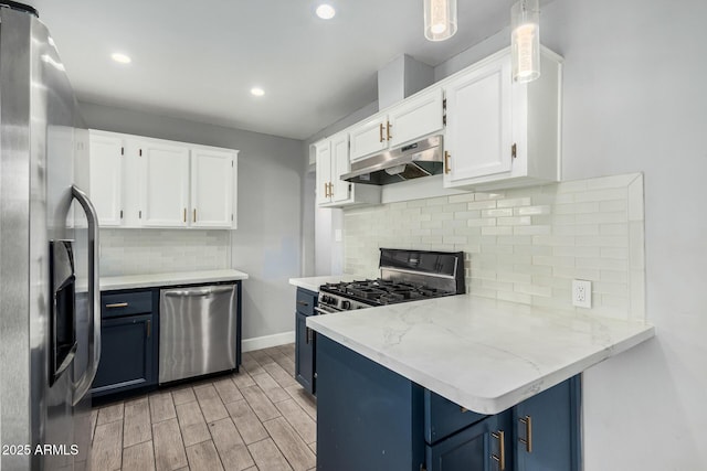 738 S Pomeroy, Mesa, AZ 85210 - kitchen with appliances with stainless steel finishes, under cabinet range hood, blue cabinetry, white cabinetry, and a peninsula