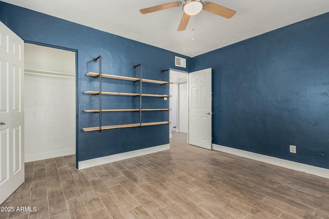 738 S Pomeroy, Mesa, AZ 85210 - unfurnished bedroom featuring wood finished floors, baseboards, a ceiling fan, and a closet