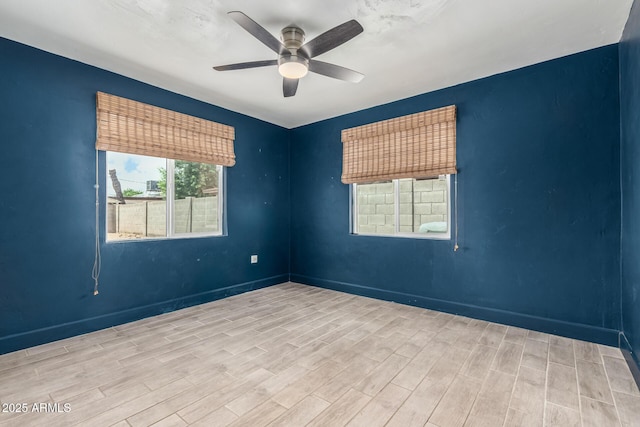 738 S Pomeroy, Mesa, AZ 85210 - empty room with wood finished floors, a ceiling fan, and baseboards