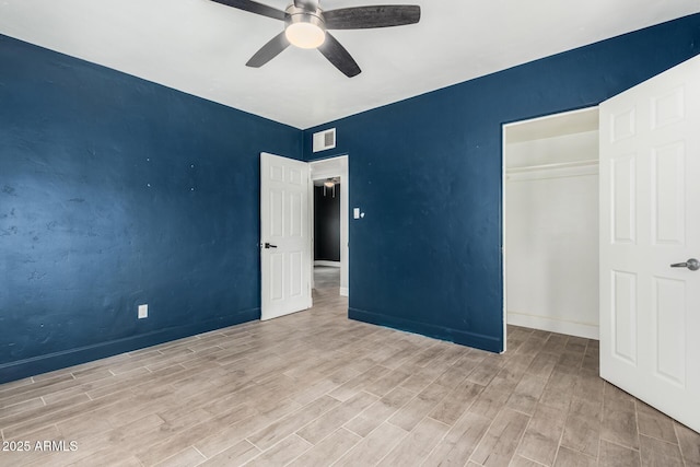 738 S Pomeroy, Mesa, AZ 85210 - unfurnished bedroom with wood finished floors, a closet, baseboards, and ceiling fan