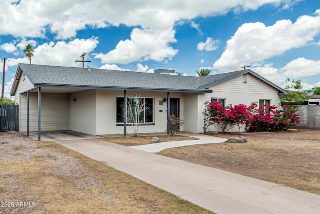 738 S Pomeroy, Mesa, AZ 85210 - single story home with roof with shingles, driveway, stucco siding, and an attached carport