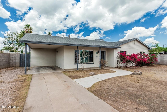 738 S Pomeroy, Mesa, AZ 85210 - ranch-style house featuring driveway, stucco siding, roof with shingles, and a carport