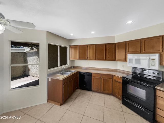 kitchen featuring light tile patterned flooring, ceiling fan, sink, and black appliances