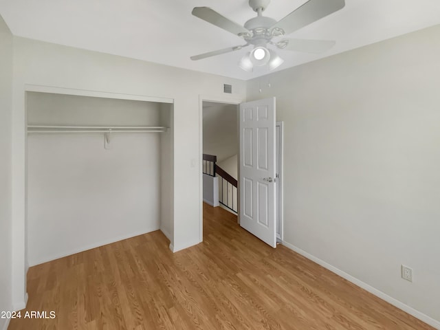 unfurnished bedroom with a closet, ceiling fan, and light hardwood / wood-style flooring