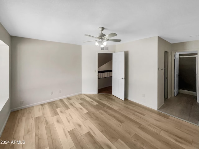 unfurnished bedroom with light wood-type flooring and ceiling fan