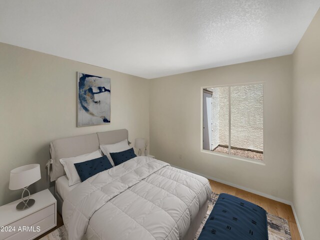 bedroom with light hardwood / wood-style floors