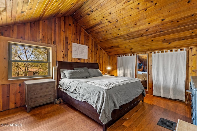 1551 Mormon Lake Rd, Mormon Lake, AZ 86038 - bedroom with lofted ceiling, wood walls, wood ceiling, and wood finished floors