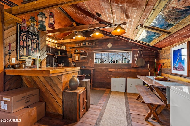 1551 Mormon Lake Rd, Mormon Lake, AZ 86038 - indoor wet bar featuring wooden walls, vaulted ceiling, wood ceiling, hardwood / wood-style floors, and washer / clothes dryer