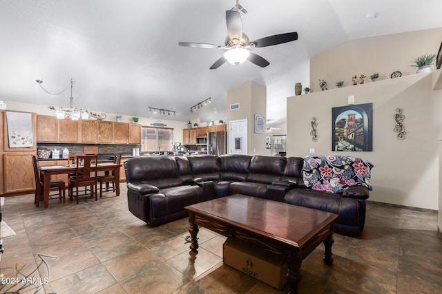 1147 N Marvin St, Gilbert, AZ 85233 - living area with ceiling fan, rail lighting, high vaulted ceiling, and stone finish flooring