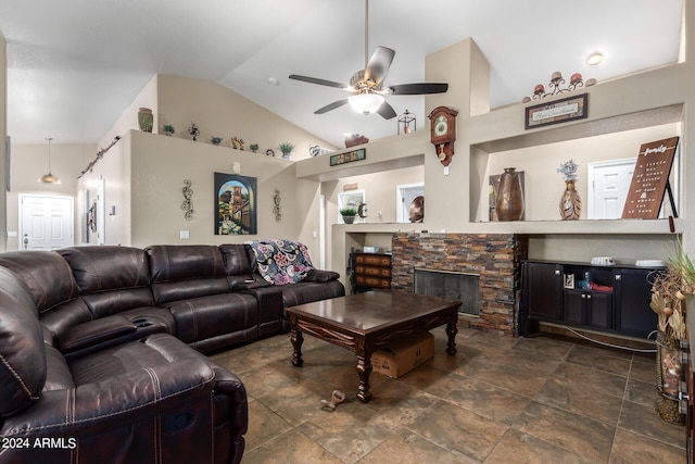 1147 N Marvin St, Gilbert, AZ 85233 - living room with a ceiling fan, a stone fireplace, lofted ceiling, and dark stone finish flooring