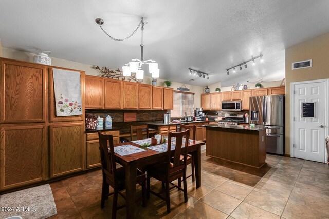 1147 N Marvin St, Gilbert, AZ 85233 - dining area with a chandelier and track lighting