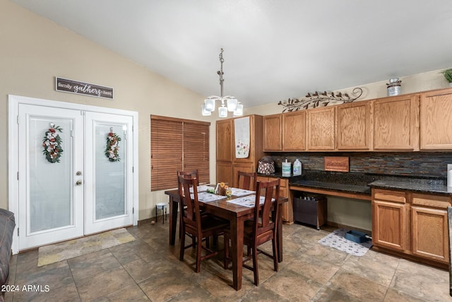 1147 N Marvin St, Gilbert, AZ 85233 - dining space featuring a chandelier, lofted ceiling, stone finish flooring, and baseboards