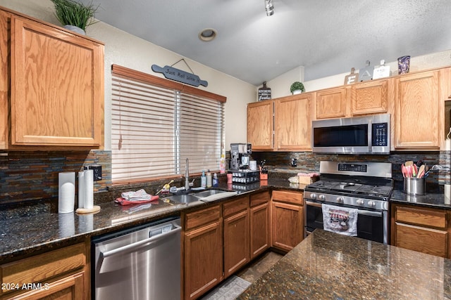 1147 N Marvin St, Gilbert, AZ 85233 - kitchen with appliances with stainless steel finishes, a sink, backsplash, and dark stone countertops