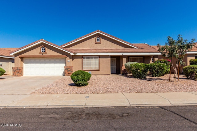 1147 N Marvin St, Gilbert, AZ 85233 - view of front of property with stucco siding, driveway, an attached garage, and a tile roof