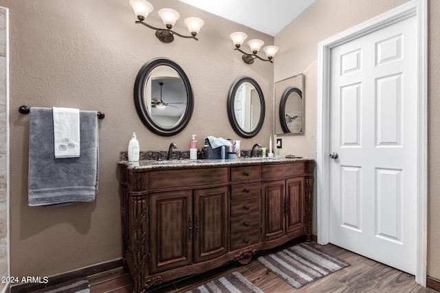 1147 N Marvin St, Gilbert, AZ 85233 - full bath with double vanity, wood finished floors, and a ceiling fan