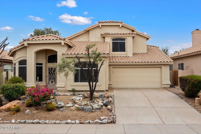 9056 E Maple Dr, Scottsdale, AZ 85255 - mediterranean / spanish-style home with stucco siding, an attached garage, a tile roof, and concrete driveway