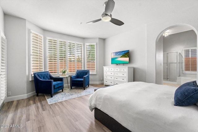 9056 E Maple Dr, Scottsdale, AZ 85255 - bedroom featuring baseboards, wood finished floors, arched walkways, and ceiling fan