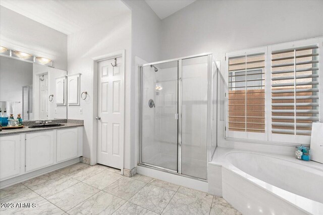 9056 E Maple Dr, Scottsdale, AZ 85255 - full bathroom featuring a bath, marble finish floor, vanity, and a stall shower