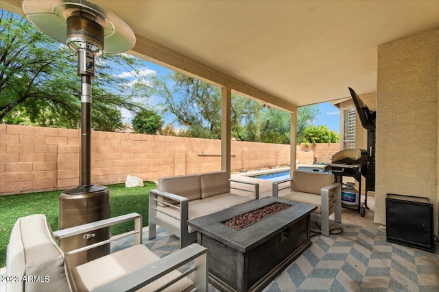 view of patio / terrace featuring an outdoor living space with a fire pit