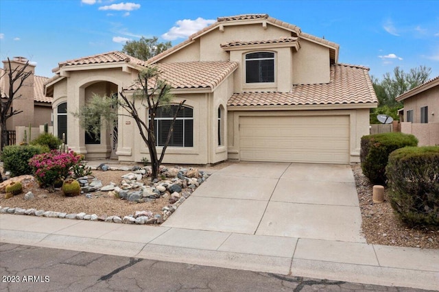 9056 E Maple Dr, Scottsdale, AZ 85255 - mediterranean / spanish-style home with a tile roof, concrete driveway, an attached garage, fence, and stucco siding