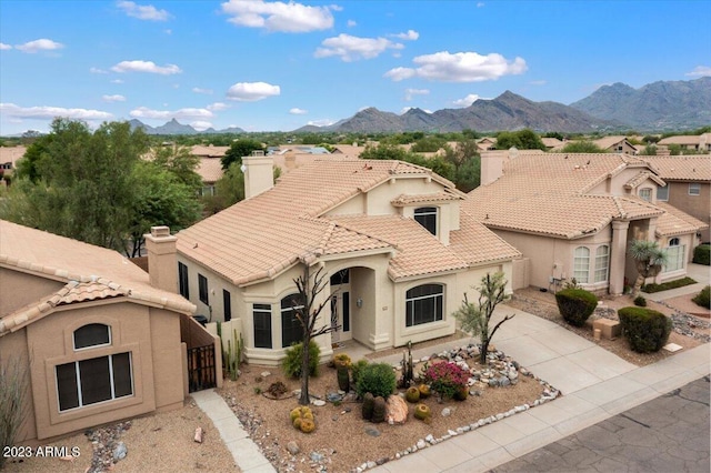 9056 E Maple Dr, Scottsdale, AZ 85255 - mediterranean / spanish house featuring a tiled roof, driveway, a chimney, and stucco siding