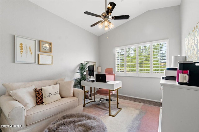 carpeted home office featuring high vaulted ceiling and ceiling fan