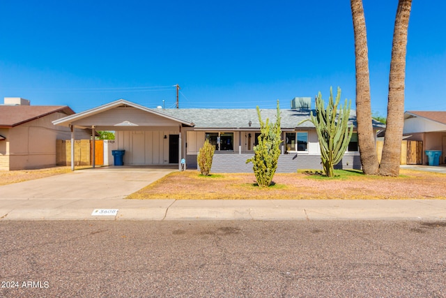 single story home featuring a carport