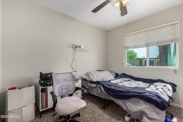 bedroom with ceiling fan and carpet floors